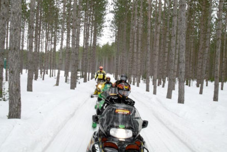 This is a picture of people snowmobiling at Beaver Creek Resort in Gaylord, MI